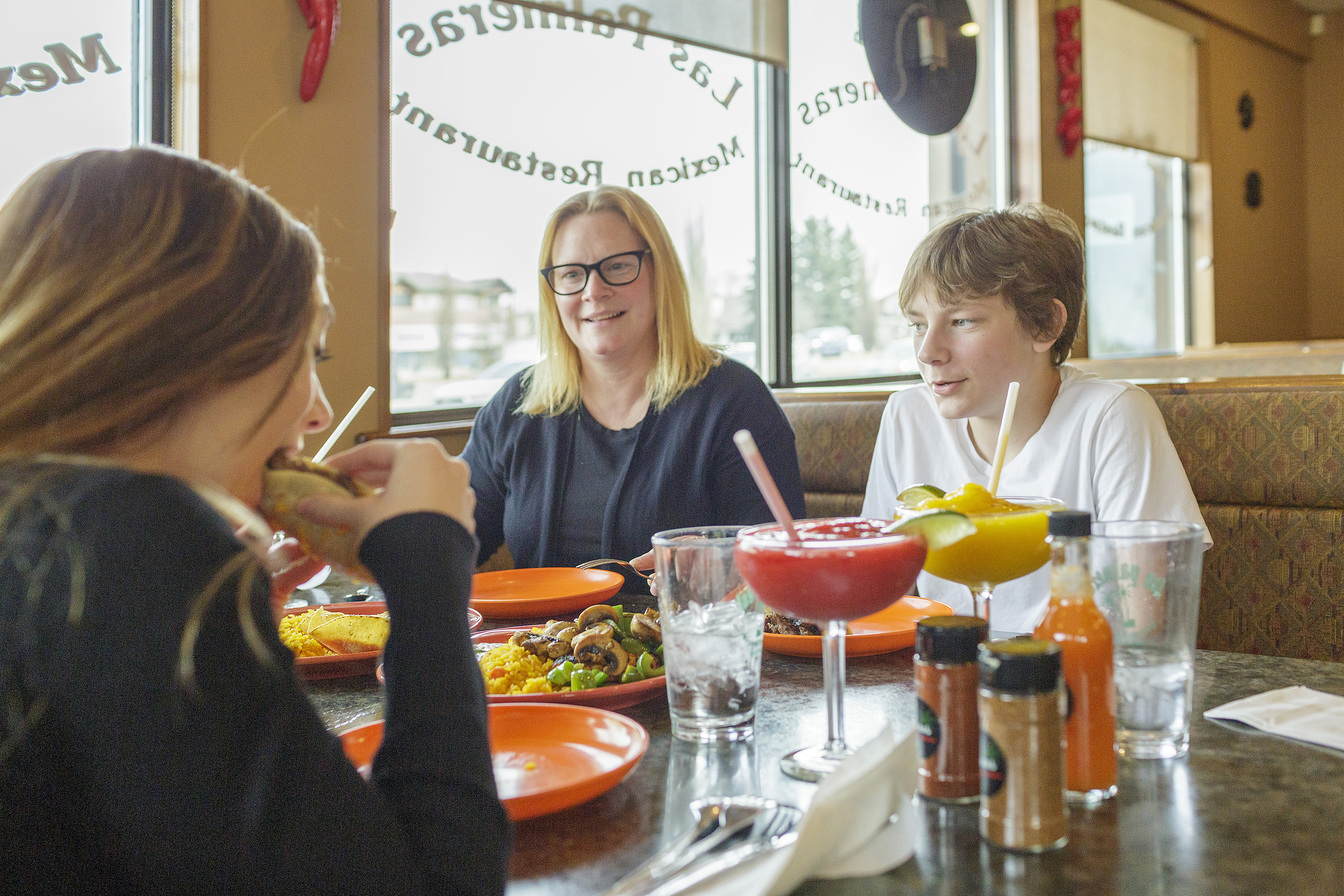 A group enjoying delicious food at Las Palmeras. 