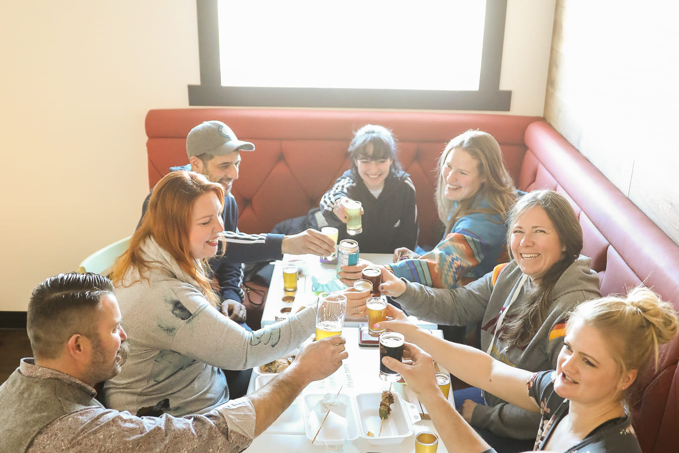 A group of people enjoying a drink together. 