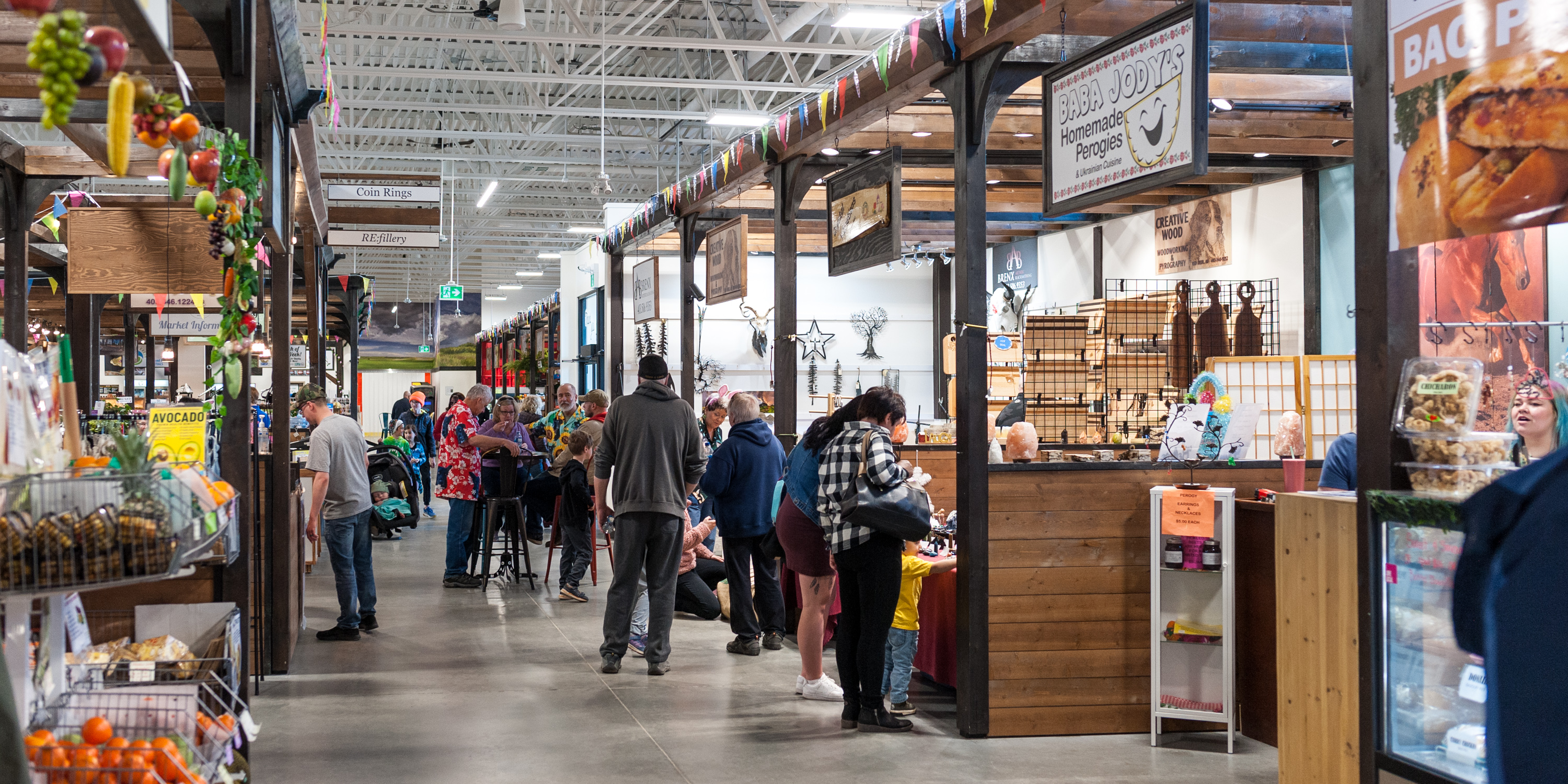 A couple enjoying the shopping at Gasoline Alley farmers market. 